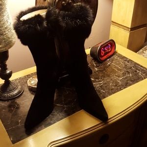 Black suede boots with rabbit fur cuff.